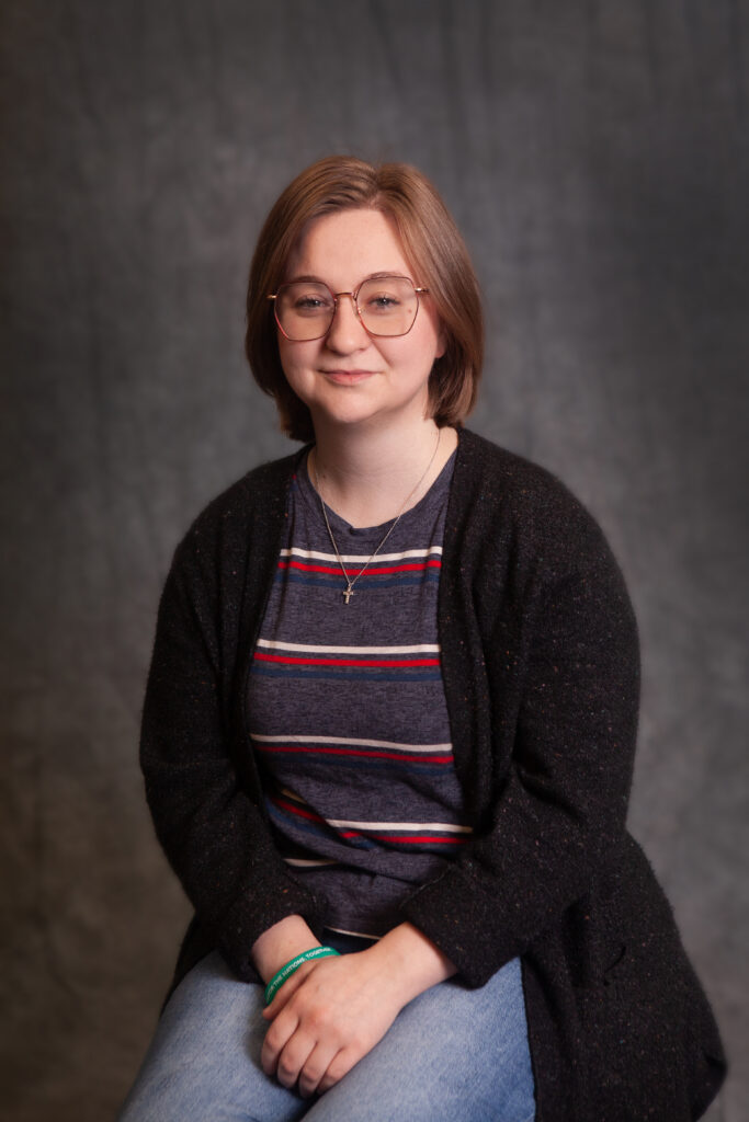 Headshot of Public Services Coordinator, Whitney